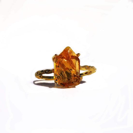 A Natural Citrine ring is just what you need to bring joy and wonder in your life. Embrace a natural Citrine stone that has a .925 sterling silver band that is dipped in 14 karat gold with AAA cubic zirconia stones. Our rings are unique in their own way & are hypoallergenic--each one is different. The beauty and energy of this stone will not go unnoticed by those around you. 